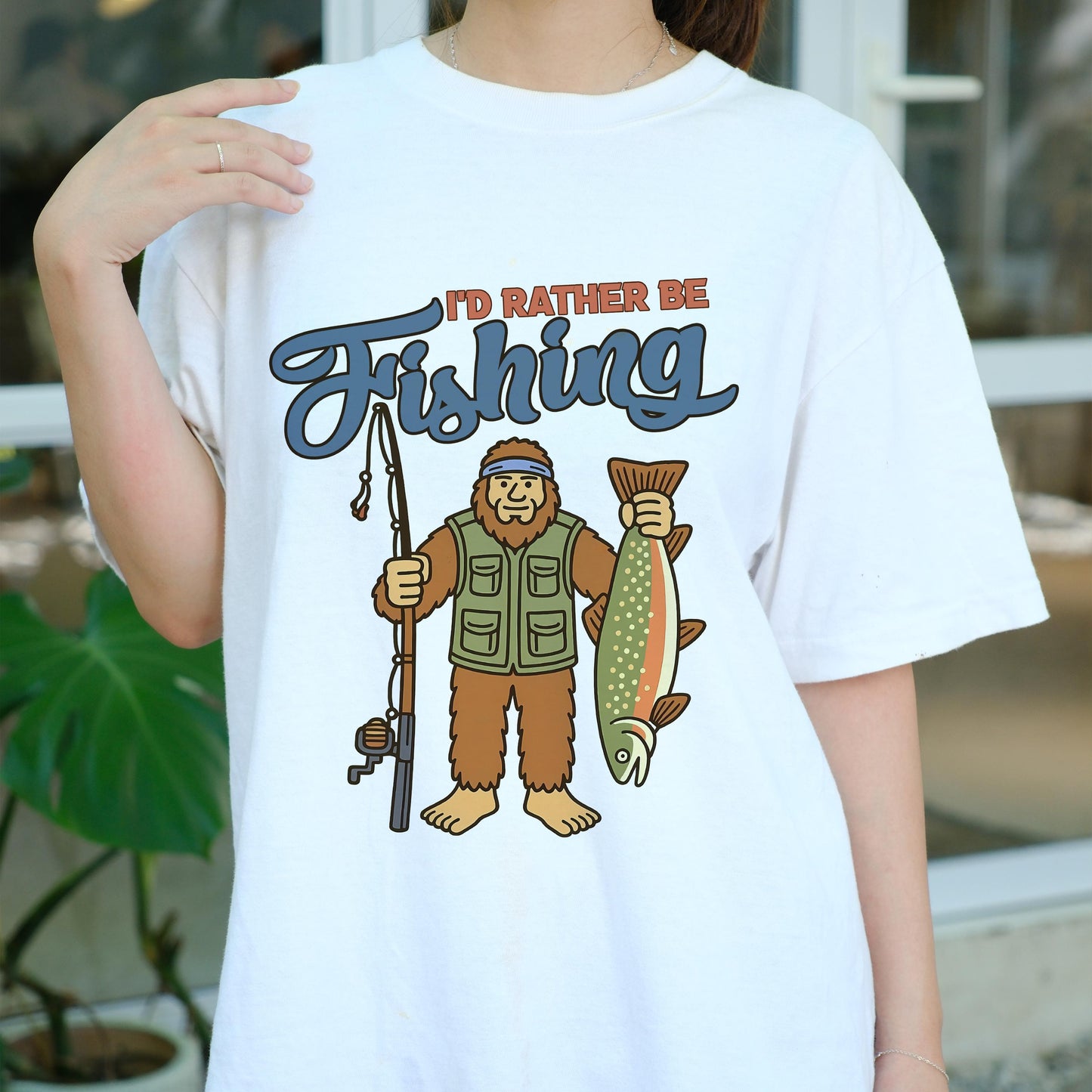 I'd Rather Be Fishing Bigfoot Shirt, Funny Fisherman Tee for Men, Sasquatch Holding Fish Graphic T-shirt, Outdoors Lake Fishing Gift
