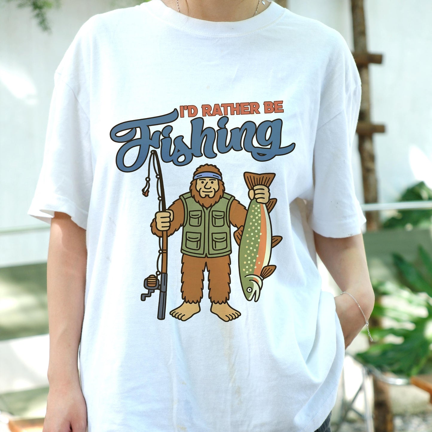 I'd Rather Be Fishing Bigfoot Shirt, Funny Fisherman Tee for Men, Sasquatch Holding Fish Graphic T-shirt, Outdoors Lake Fishing Gift