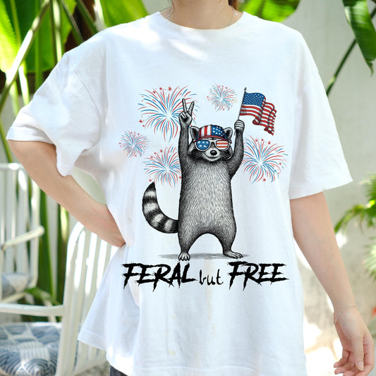 Feral But Free Raccoon Shirt, Funny 4th of July USA Tee, Patriotic Trash Panda T-Shirt, Fireworks America Animal Shirt, Freedom Gift