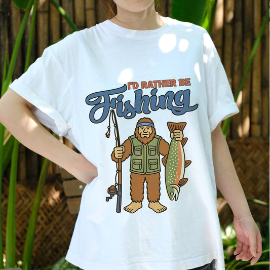 I'd Rather Be Fishing Bigfoot Shirt, Funny Fisherman Tee for Men, Sasquatch Holding Fish Graphic T-shirt, Outdoors Lake Fishing Gift